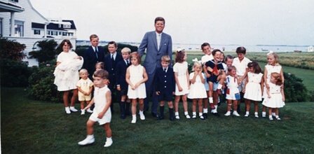 President Kennedy poses with members of the younger generation of Kennedys, Hyannis Port, Massachusetts Cecil Stoughton/The White House
